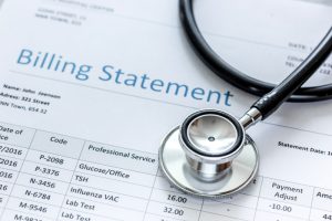 medical treatment billing statement with stethoscope in background for medical credentialing
